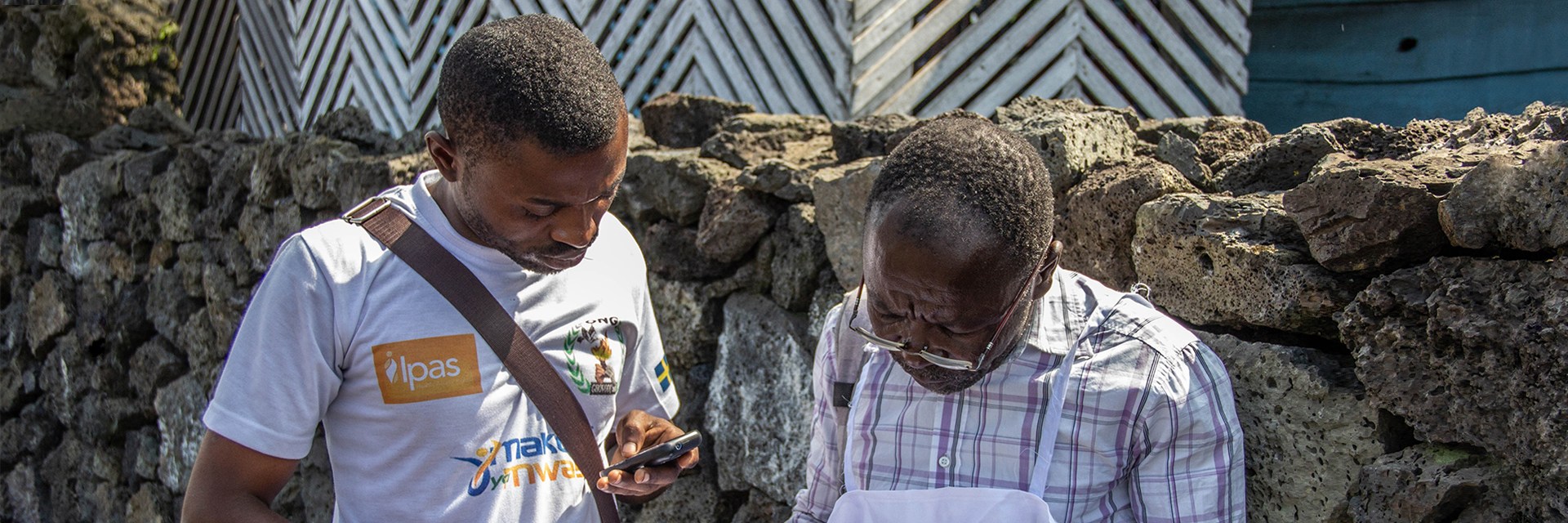 Two people looking at a paper 
