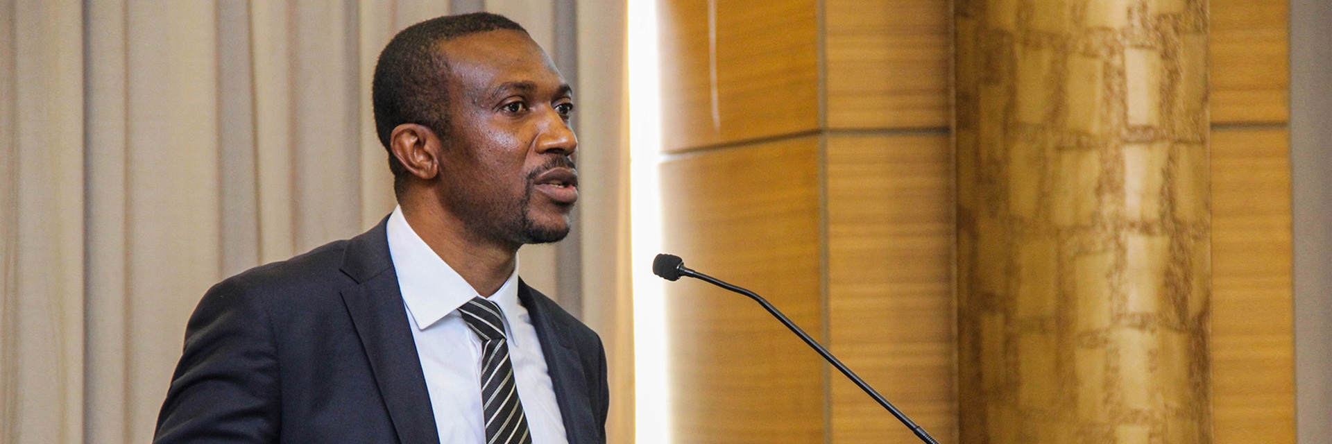 A person speaking through mic